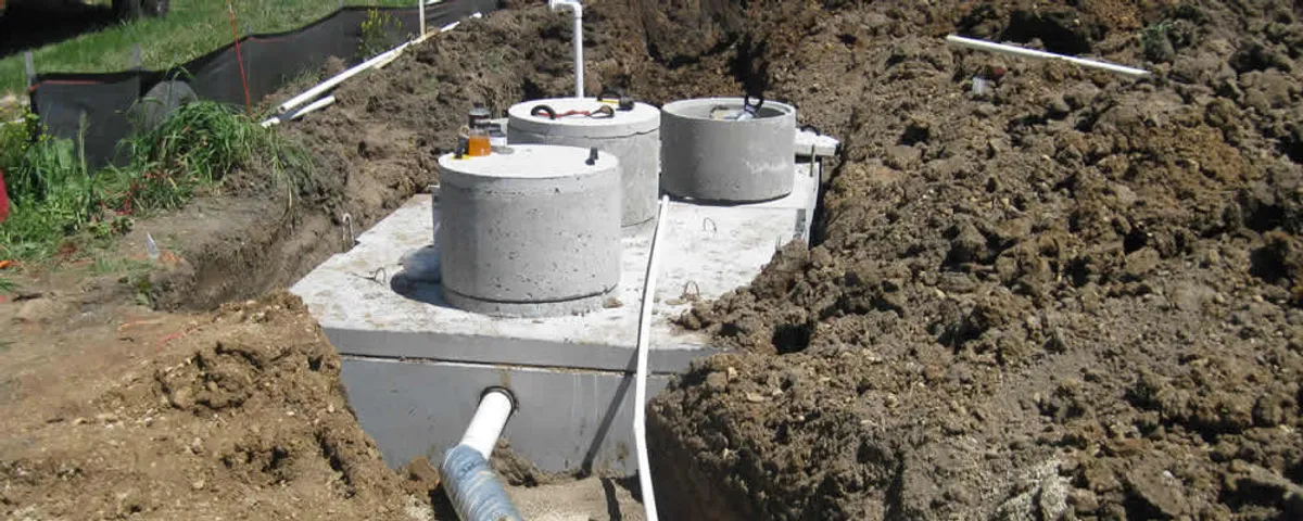 Septic system repair and installation site with tank access ports in Kissimmee, FL